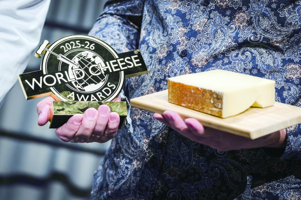 A photo shows the World Cheese Awards first prize winner, a Gruyere AOP presented by Swiss cheese maker Hitz Pius, from the Vorderfultigen cheese company, during the 37th edition of the World Cheese Awards in Bern. — AFP