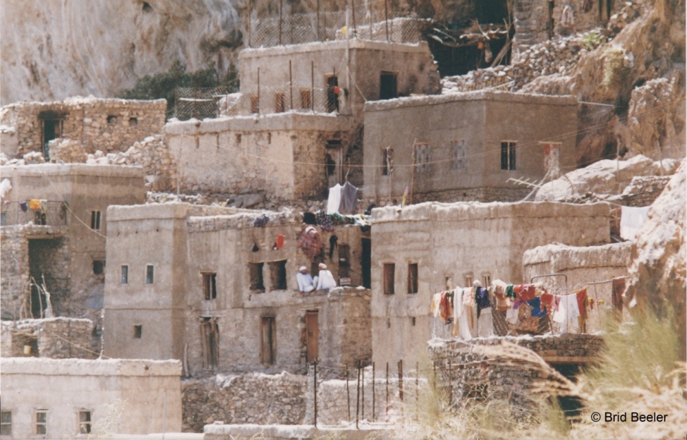 Wajmah, one of the many mountain villages tucked beneath the cliffs of Jebel Shams