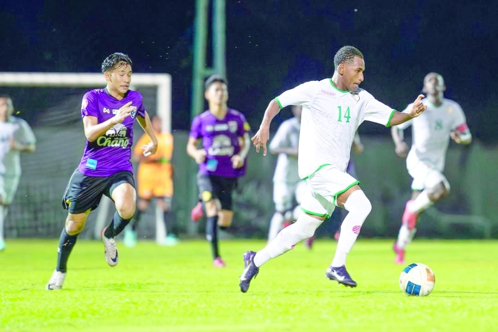 Oman and Thailand players in action.