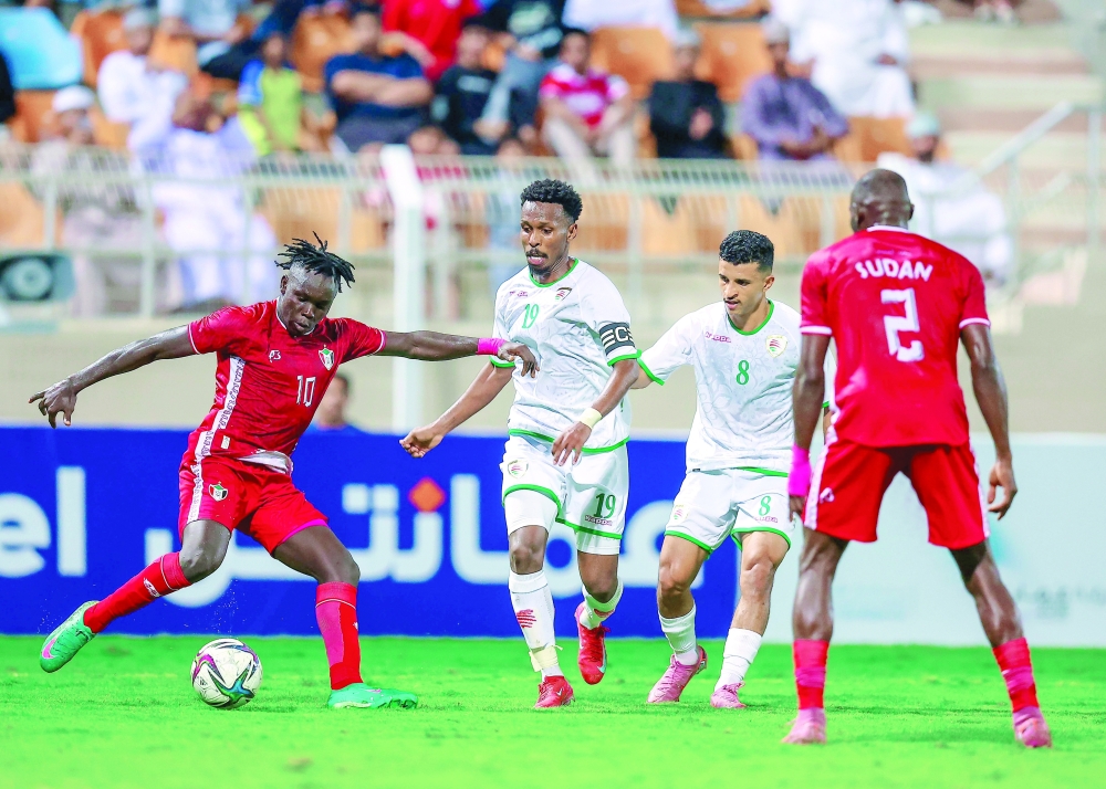 Oman and Sudan players in action. 