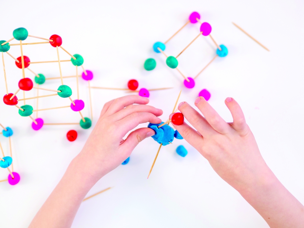 top-view-little-boy-playing-with-interesting-game