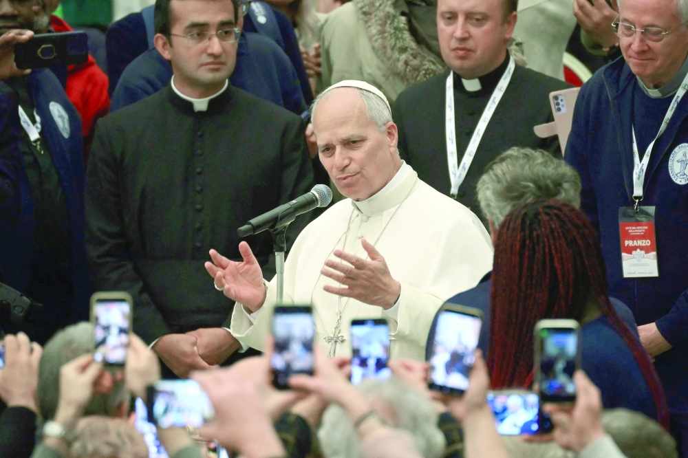 Pope Leo XIV attends the event of the World Day of the Poor at the Paul VI audience hall in the Vatican. — AFP