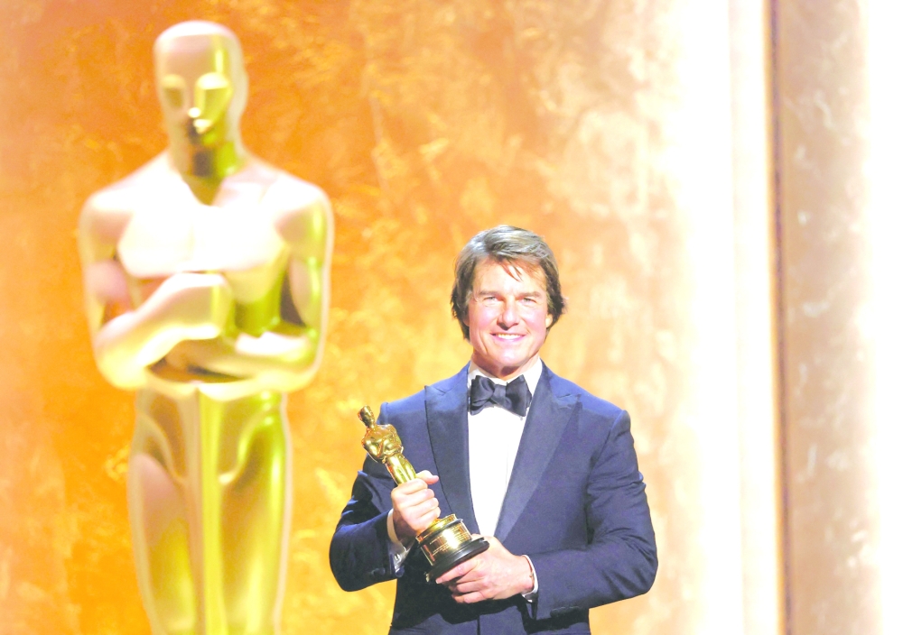 US actor producer Tom Cruise poses with his Honorary Academy Award on stage during the 16th Governors Awards at the Ray Dolby Ballroom at Ovation Hollywood in Los Angeles on November 16, 2025. (Photo by Michael Tran / AFP)
