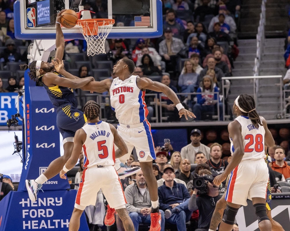 Detroit Pistons center Jalen Duren (0) fouls Indiana Pacers forward Jarace Walker (5) during the first quarter at Little Caesars Arena. — Imagn Images