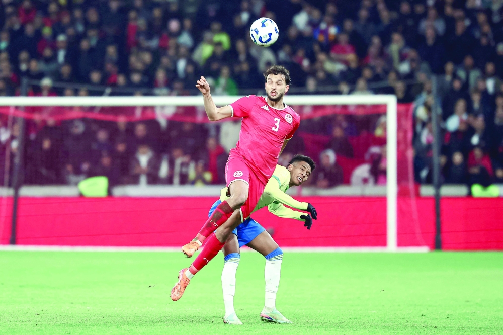 Tunisia's defender #03 Montassar Talbi (CL) heads the ball in front of Brazil's forward #20 Estevao (CR) during the International friendly football match between Brazil and Tunisia at Stade Pierre-Mauroy, in Villeneuve-d'Ascq, northern France. — AFP