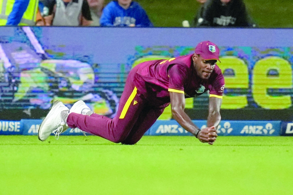 West Indies' Justin Greaves catches New Zealand Mark Chapman during the second one-day international cricket match between New Zealand and the West Indies. — AFP
