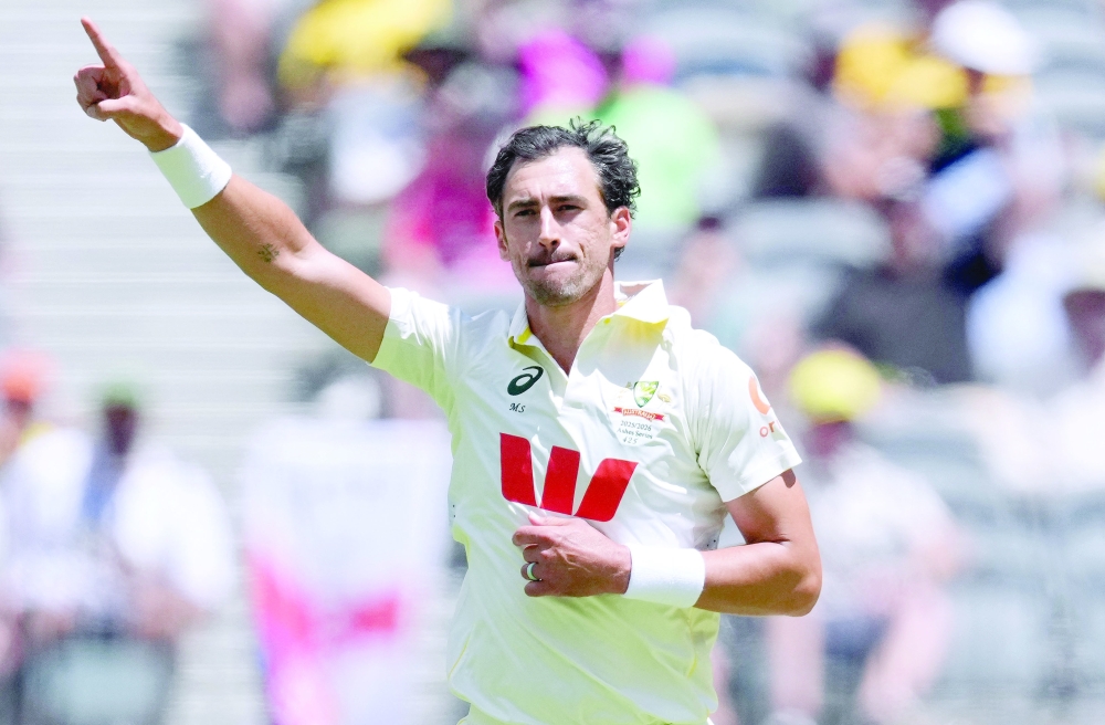 Australia's Mitchell Starc celebrates after taking the wicket of England's Ben Stokes. — Reuters