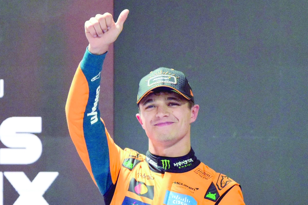 McLaren's British driver Lando Norris gestures after winning the pole position during the qualifying session for the Las Vegas Formula One Grand Prix at the Las Vegas Strip Circuit. — AFP