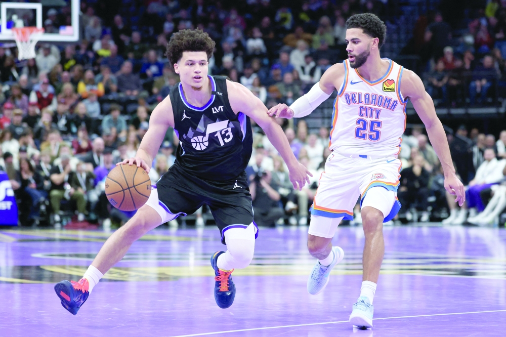 Utah Jazz guard Walter Clayton Jr (13) moves the ball against Oklahoma City Thunder guard Ajay Mitchell (25) during the second half at Delta Center. —  Imagn Images