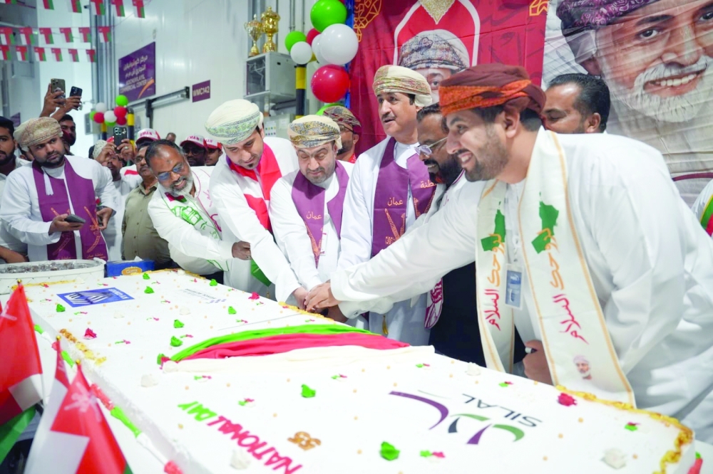 Officials, traders and workers at the Silal market celebrate Oman's National Day.