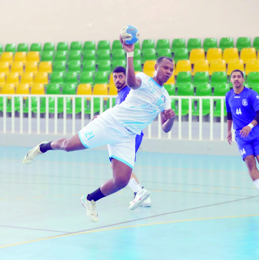 Oman Club and Nizwa players in action.