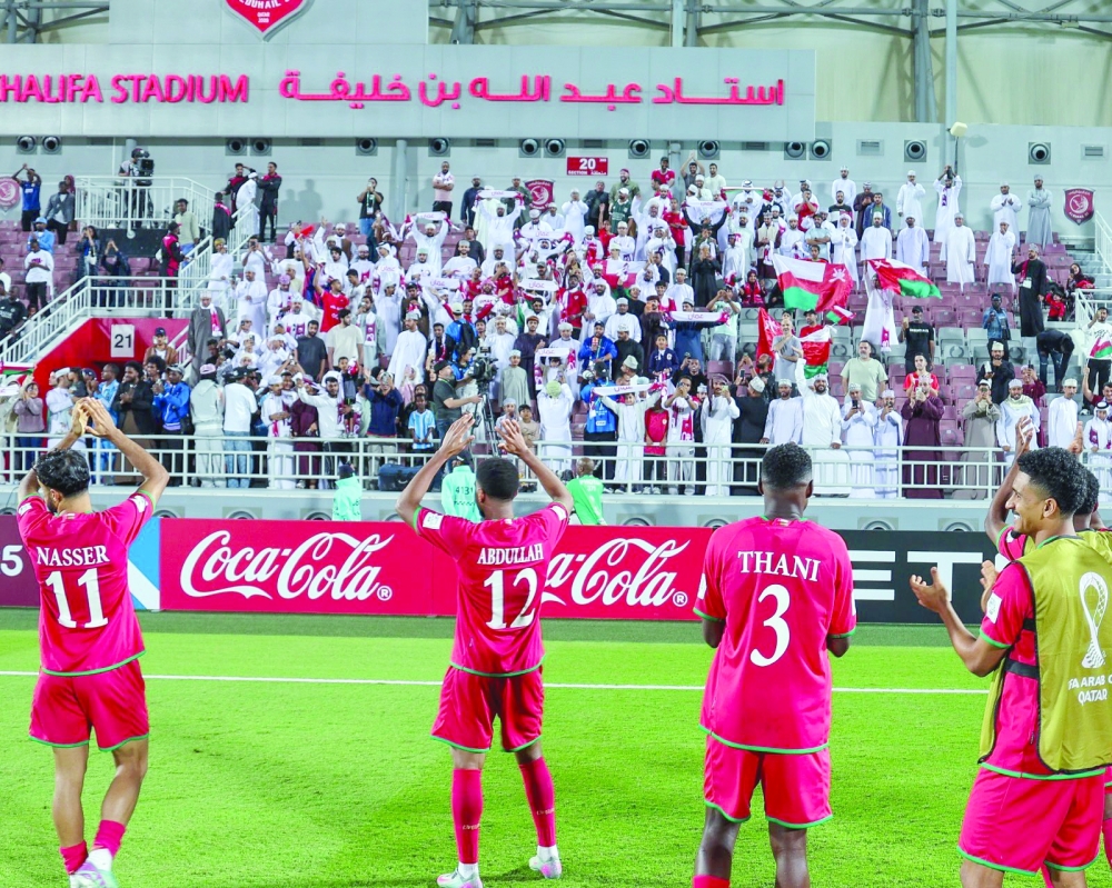  Oman players celebrate with fans after the qualification. 
