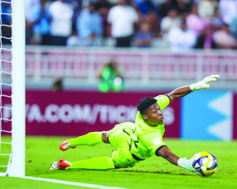 Oman goalkeeper Ibrahim al Rajhi saves a penalty kick against Somalia. 