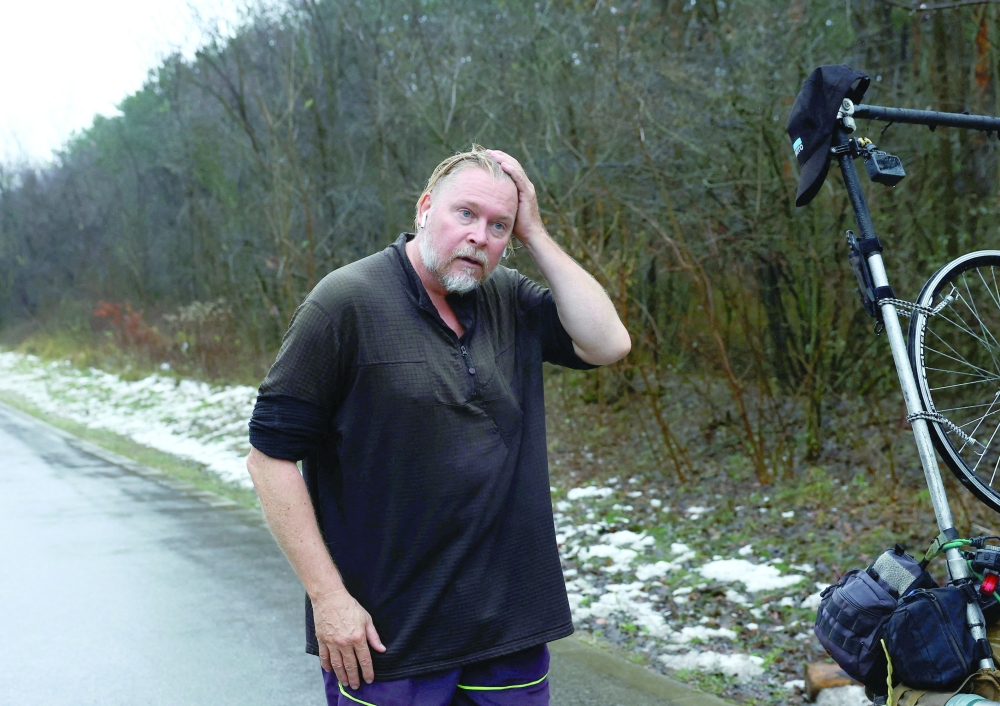 British ex-paratrooper Karl Bushby, who has been walking across the world for 27 years, reacts during his trip in Komarom, Hungary, on Wednesday. - Reuters