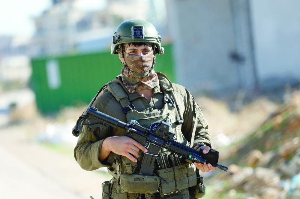 An Israeli soldier takes part in an operation in Tubas, in the Israeli-occupied West Bank, on Wednesday. - Reuters