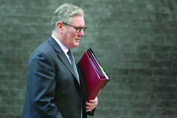 UK unveils tax-raising budget as growth hit