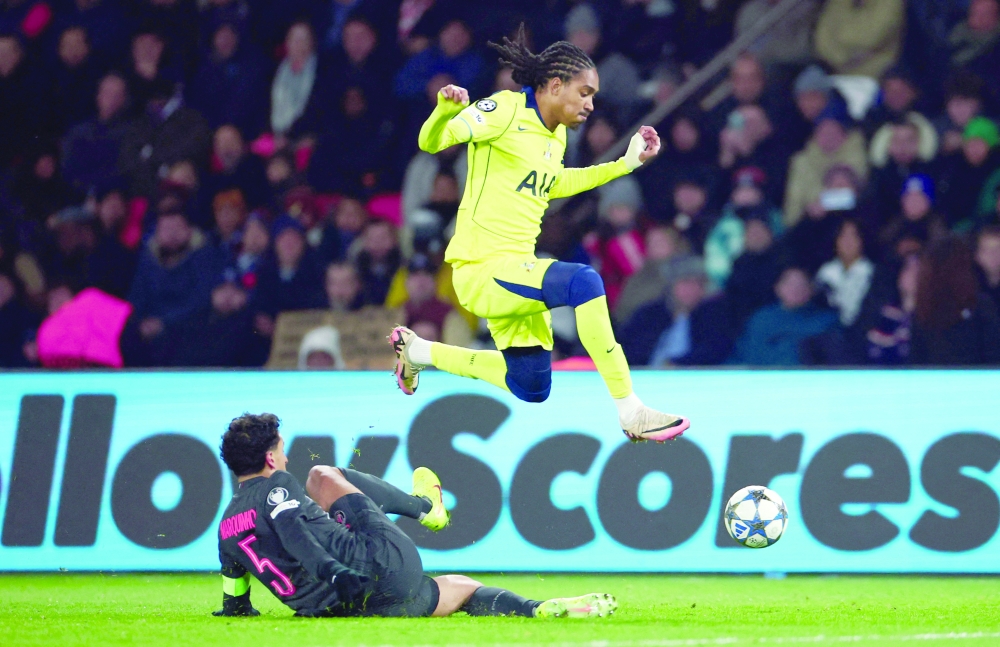 Paris St Germain's Marquinhos in action with Tottenham Hotspur's Djed Spence. — Reuters
