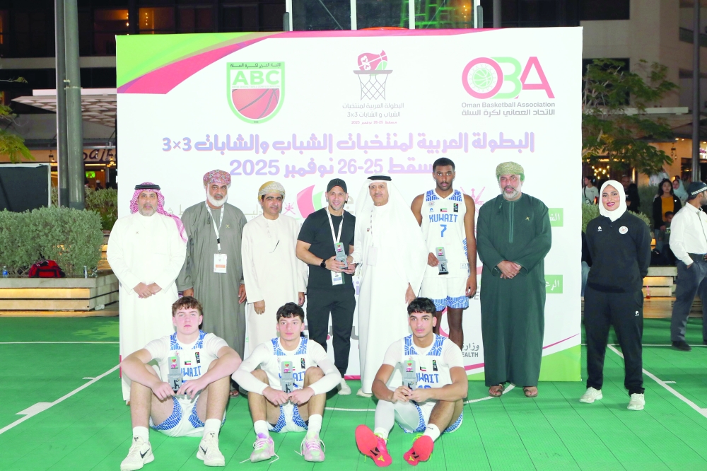 Kuwait players pose with silver medals. — Ammar al Musafir