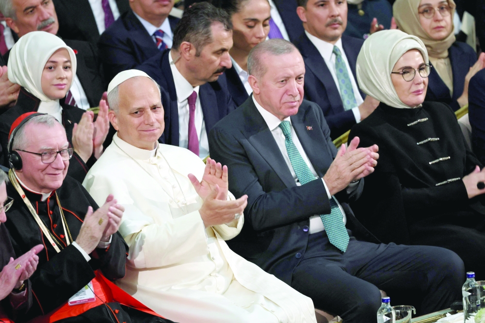Pope Leo XIV, Türkiye's President Recep Tayyip Erdogan and his wife Emine Erdogan attend a meeting with representatives of Türkiye's authorities, civil society and diplomatic corps as part of the Pope's official visit at the Turkish national Library in Ankara. - AFP