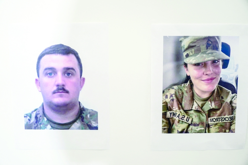 Pictures of National Guard members Andrew Wolfe and Sarah Beckstrom.— Reuters