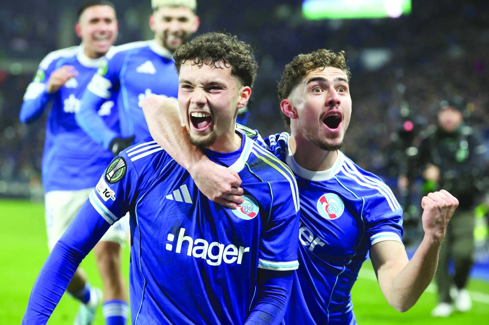 Strasbourg's French midfielder #29 Samir El Mourabet (L) celebrates scoring his team's second goal with Strasbourg's Argentine forward #09 Joaquin Panichelli during the UEFA Europa Conference League football match between RC Strasbourg Alsace and Crystal Palace FC at the Stade de la Meinau in Strasbourg, eastern France, on November 27, 2025.  (Photo by Frederick FLORIN / AFP)
