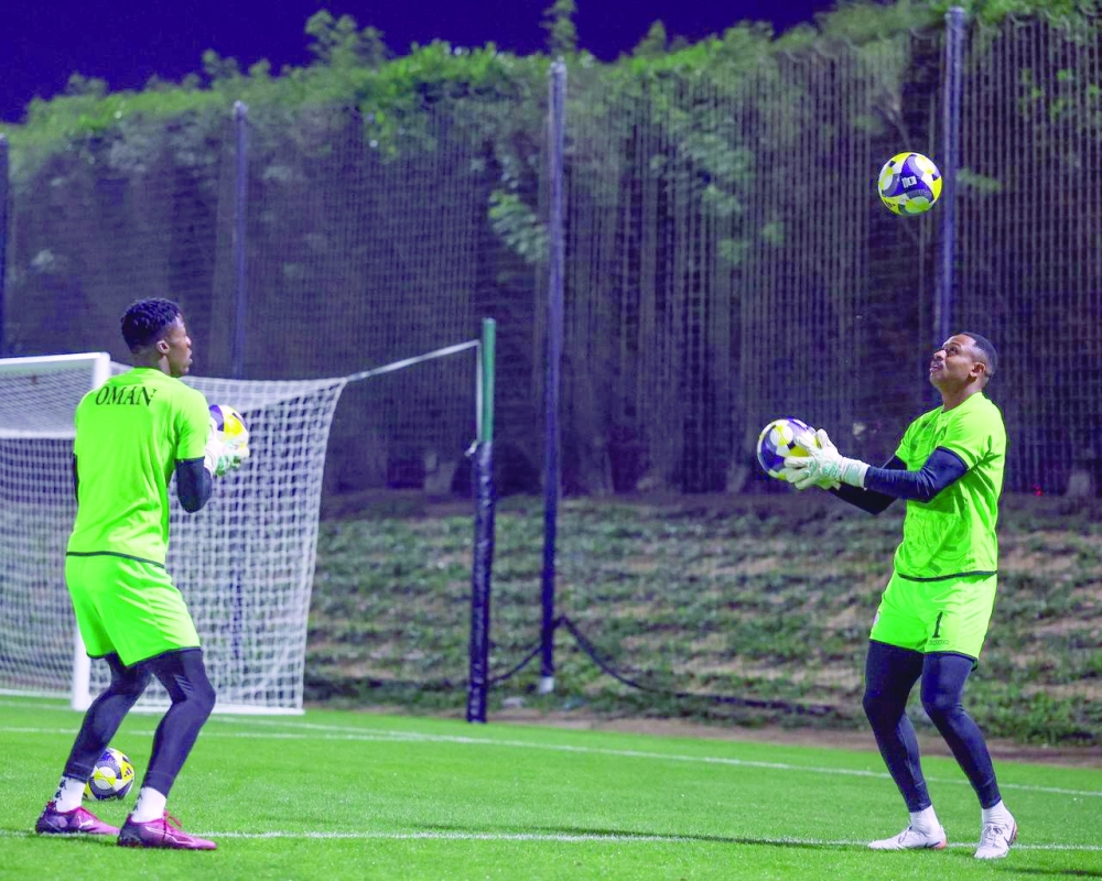 Oman goalkeepers Ibrahim al Rajhi (L) and Ibrahim al Mukhaini during the training session.
