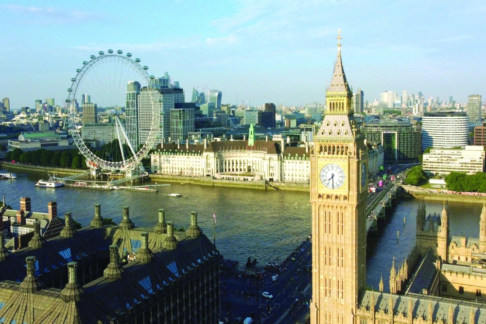 The Big Ben and The London Eye are seen on a summer evening in London, Britain. — Reuters