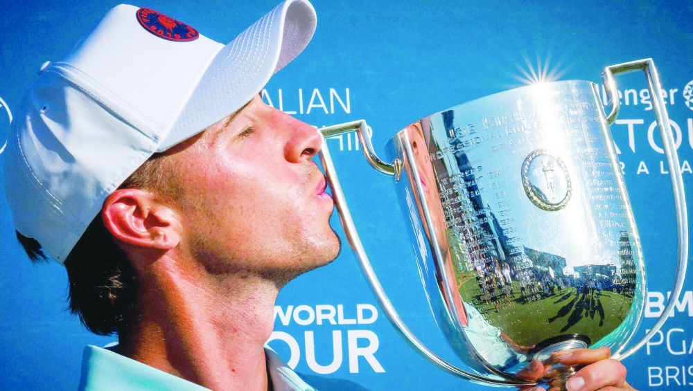 David Puig celebrates with the trophy.