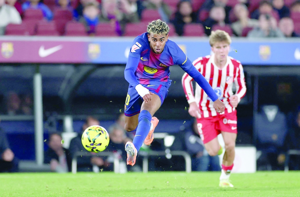 Barcelona's Spanish forward #10 Lamine Yamal kicks the ball during the Spanish league football match between FC Barcelona and Club Atletico de Madrid at Camp Nou Stadium in Barcelona. — AFP 