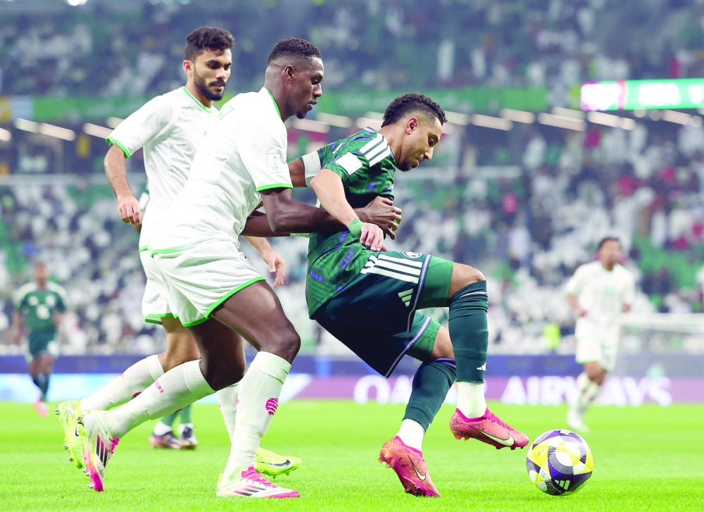 Saudi Arabia's Salem al Dawsari in action with Oman's Thani al Rushaidi during the Fifa Arab Cup Qatar 2025 Group B match at Education City Stadium, Al Rayyan, Qatar. — Reuters