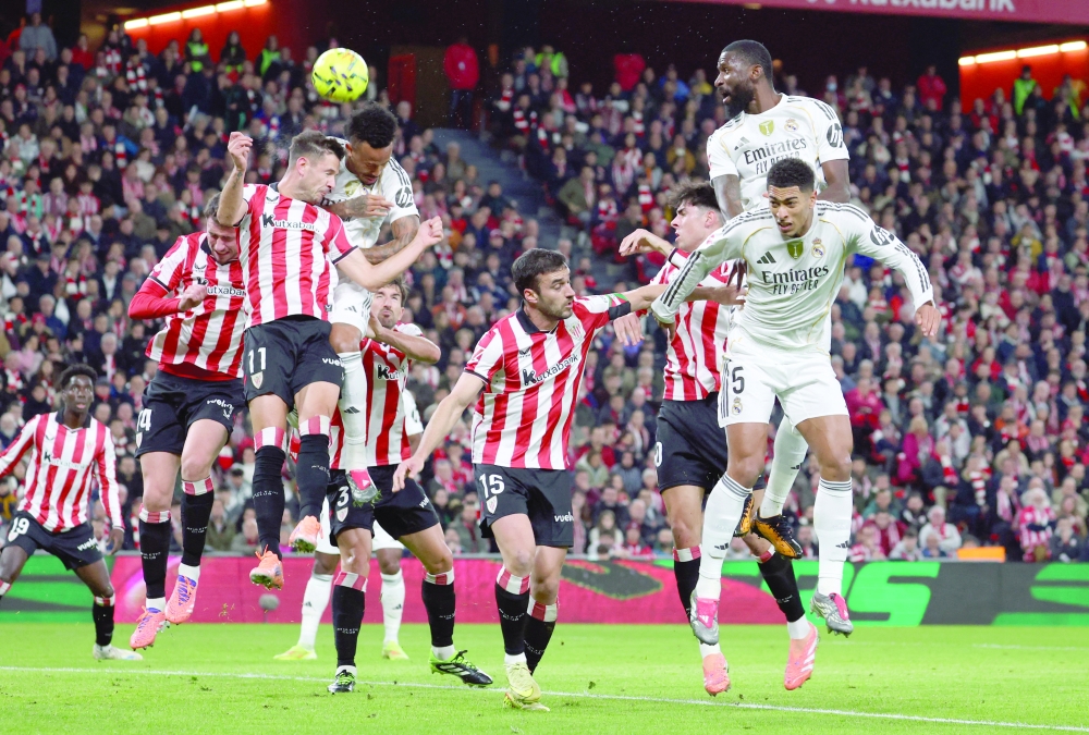 Real Madrid's Eder Militao in action with Athletic Bilbao's Gorka Guruzeta. — Reuters
