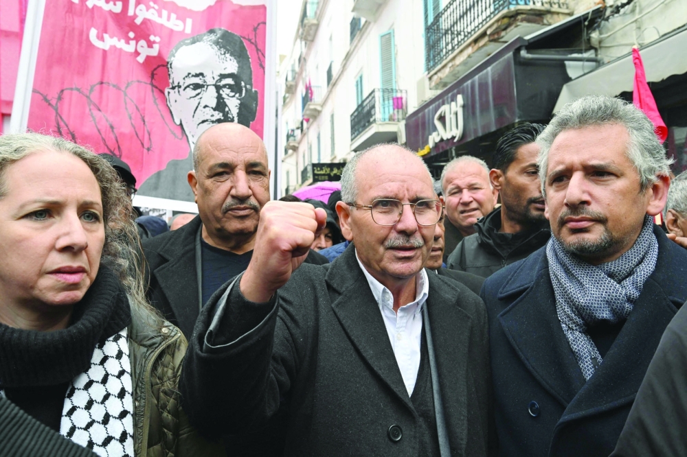 Noureddine Taboubi, head of the Tunisian General Labour Union, joins a protest outside the UGTT headquarters in Tunis. - AFP