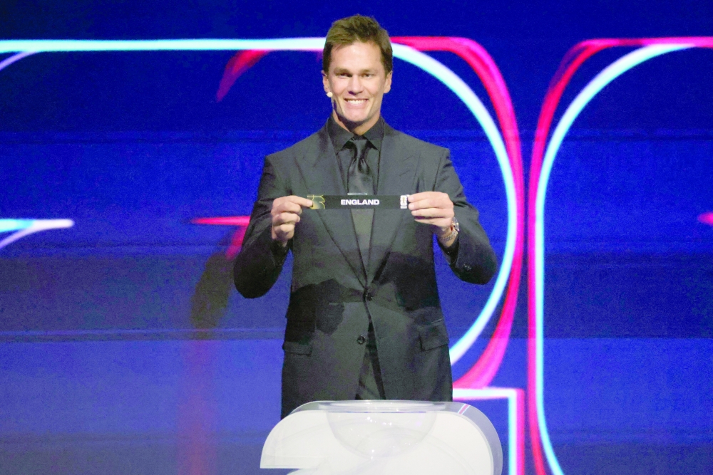 Tom Brady draws the card of England for Group L during the Fifa World Cup 2026 Final Draw. — Reuters