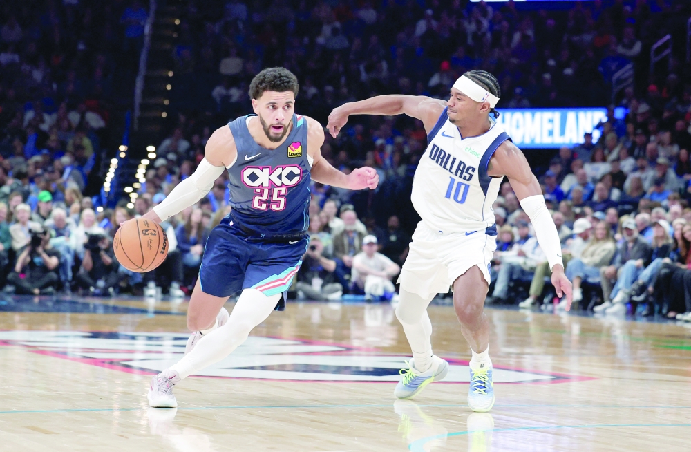 Oklahoma City Thunder guard Ajay Mitchell (25) drives past Dallas Mavericks guard Brandon Williams (10). — Reuters 