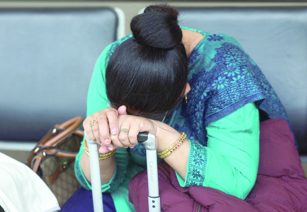 A passenger waits outside the IndiGo Airlines ticketing counter at Terminal 1 of Mumbai's domestic airport on Saturday. — Reuters