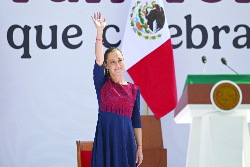 Mexico's President Claudia Sheinbaum gestures on arrival for the rally, in Mexico City. — AFP