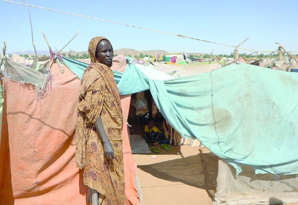 A Sudanese woman stands at a camp for displaced people, North Darfur. — Reuters file photo