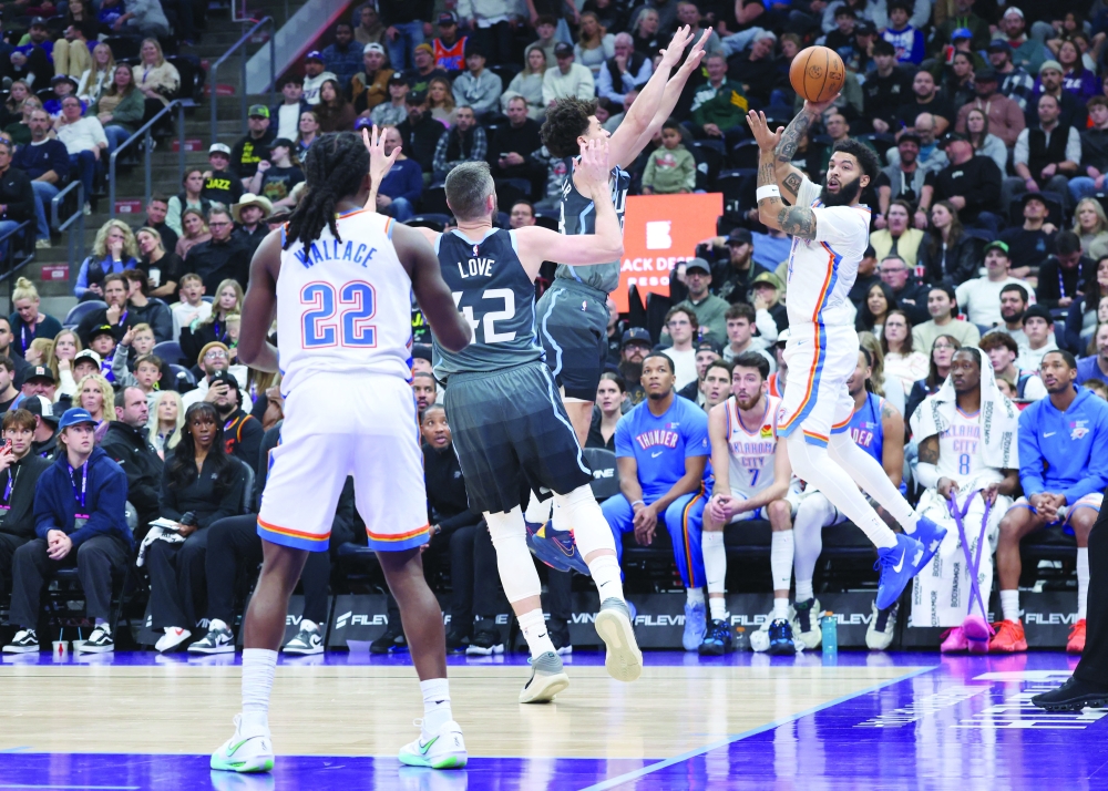 Oklahoma City Thunder guard Kenrich Williams (34) leaps to save the ball from going out of bounds against the Utah Jazz. — Reuters