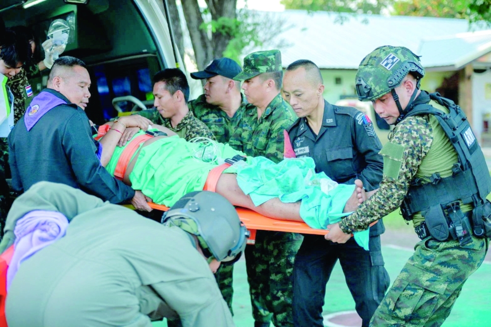 An injured soldier is transferred to a hospital after border clash in Sisaket Province, Thailand. — Reuters