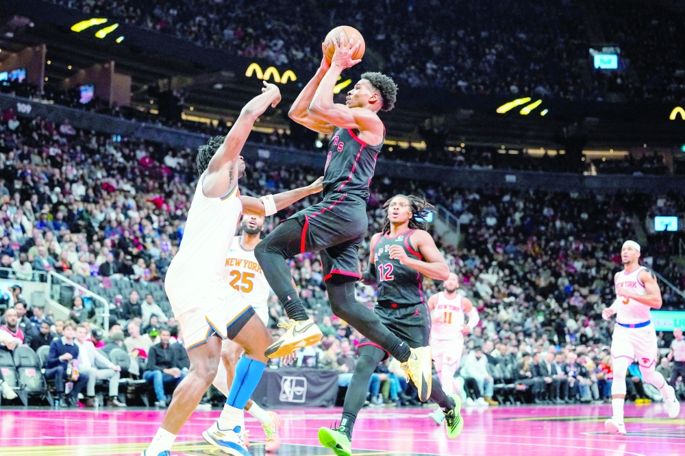 
Toronto Raptors guard Ochai Agbaji (30) drives to the basket against New York Knicks forward Og Anunoby (8). — Reuters 