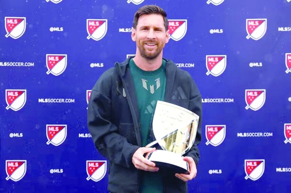 
Lionel Messi celebrates with the MLS MVP award. 