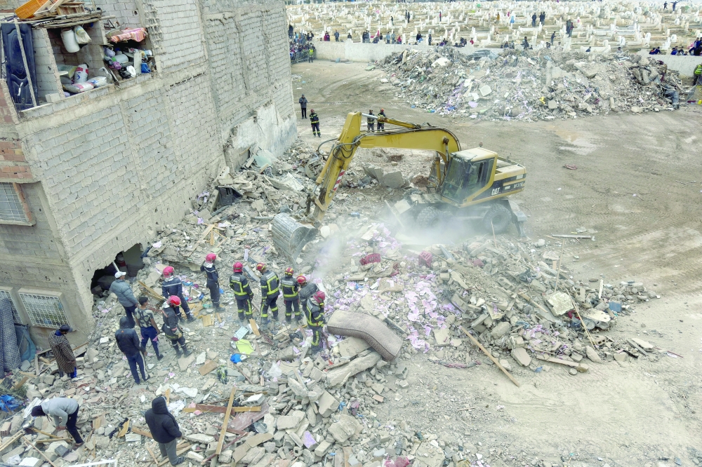 Rescuers work at the site of the collapse of two buildings in Fes, Morocco, December 10, 2025. REUTERS