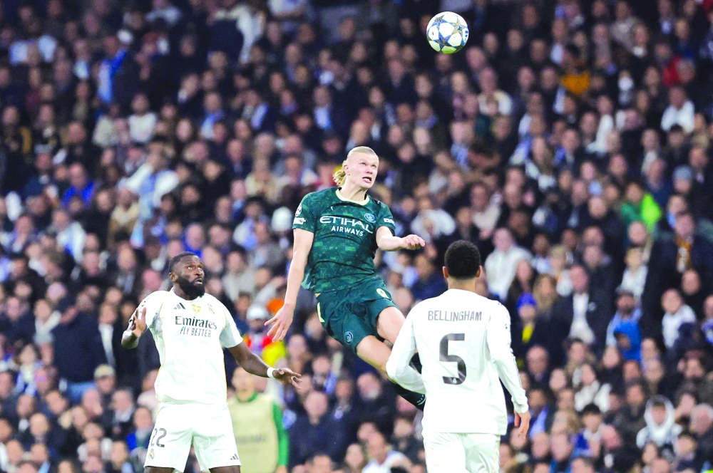 Manchester City's Norwegian forward #09 Erling Braut Haland and Real Madrid's German defender #22 Antonio Ruediger (L) go for a header. — AFP 