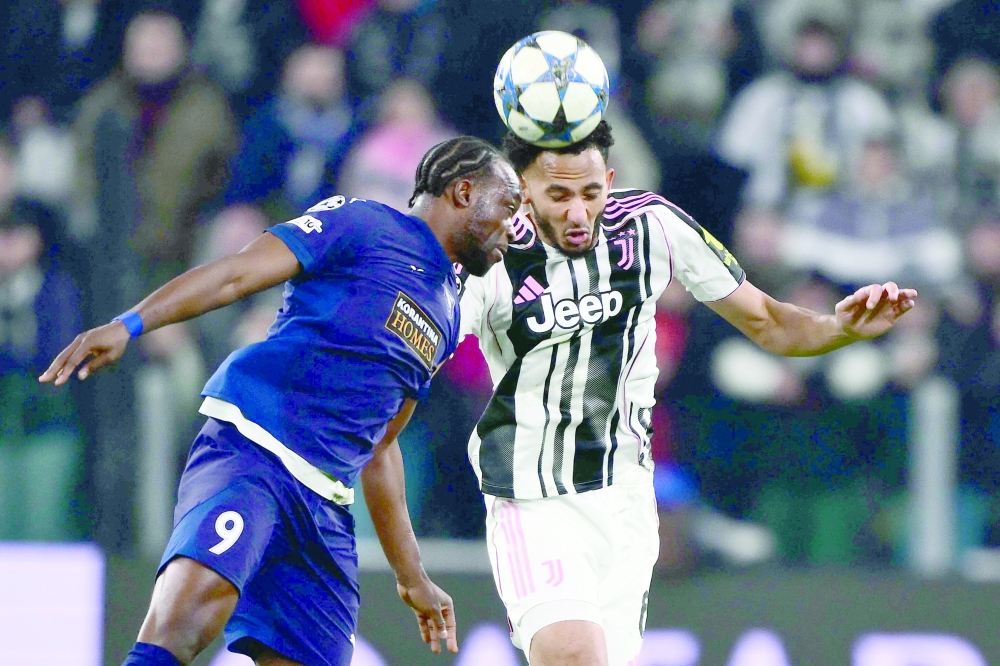 Juventus' English defender #06 Lloyd Kelly fights for the ball with Pafos FC's Congolese forward #09 Mons Bassouamina during the UEFA Champions League - league phase day 6 football match between Juventus and Pafos FC. — AFP