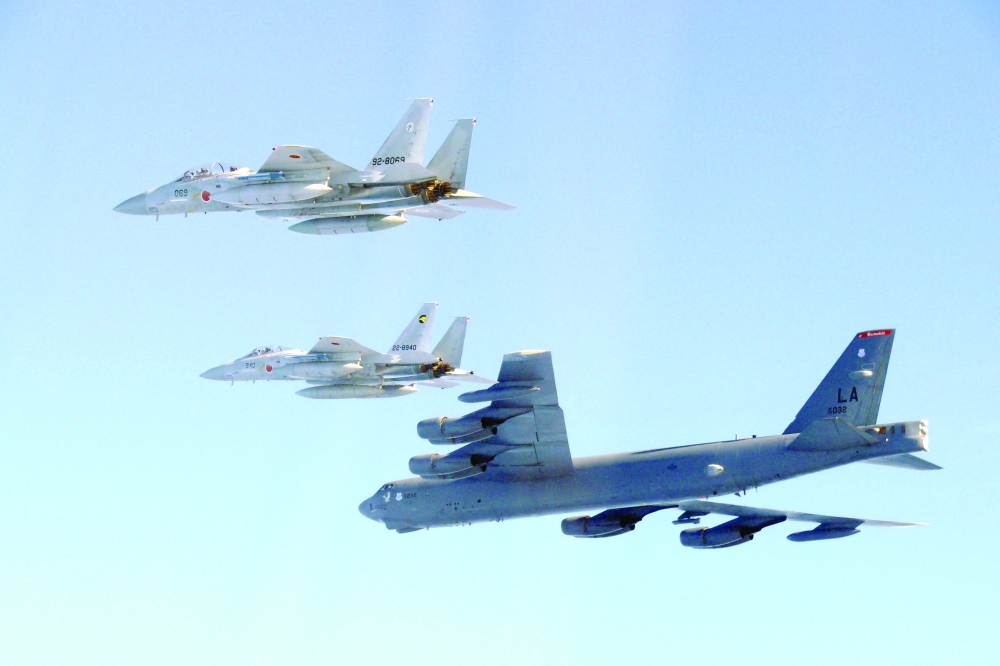 The 6th Air Wing of Japan Air Self-Defence Force's F-15 fighters hold a joint military drill with the US B-52 bomber over Sea of Japan. — Reuters