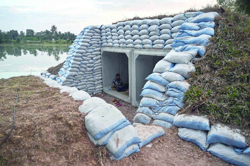 A displaced resident rests in a bunker in Thailand's Surin province on December 11, 2025, amid clashes along the Thai-Cambodia border. Renewed fighting raged at the border of Cambodia and Thailand on December 11, with combat heard near centuries-old temples, ahead of an expected phone call from US President Donald Trump to the two nations' leaders.