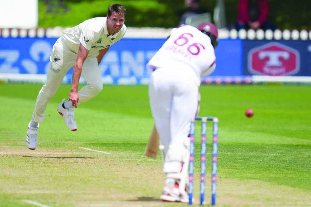 New Zealand's Jacob Duffy bowls during day three of the 2nd international Test cricket match between New Zealand and West Indies at the Basin reserve in Wellington on December 12, 2025. (Photo by Marty MELVILLE / AFP)
