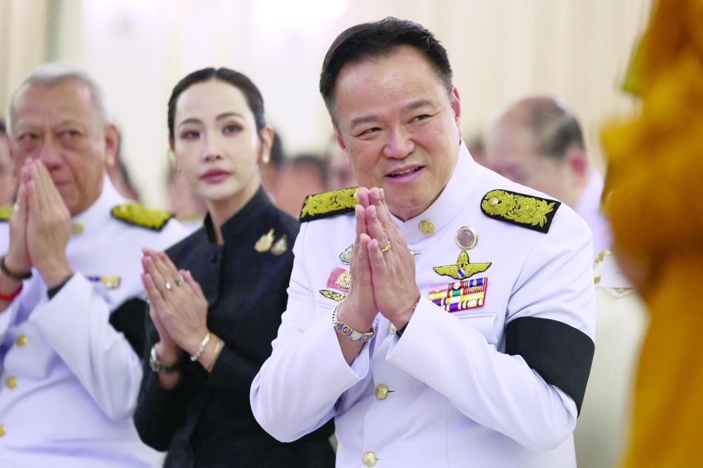 Thailand's Prime Minister Anutin Charnvirakul greets his cabinet as he speaks to media to announce the dissolution of parliament at the Government House in Bangkok. — Reuters