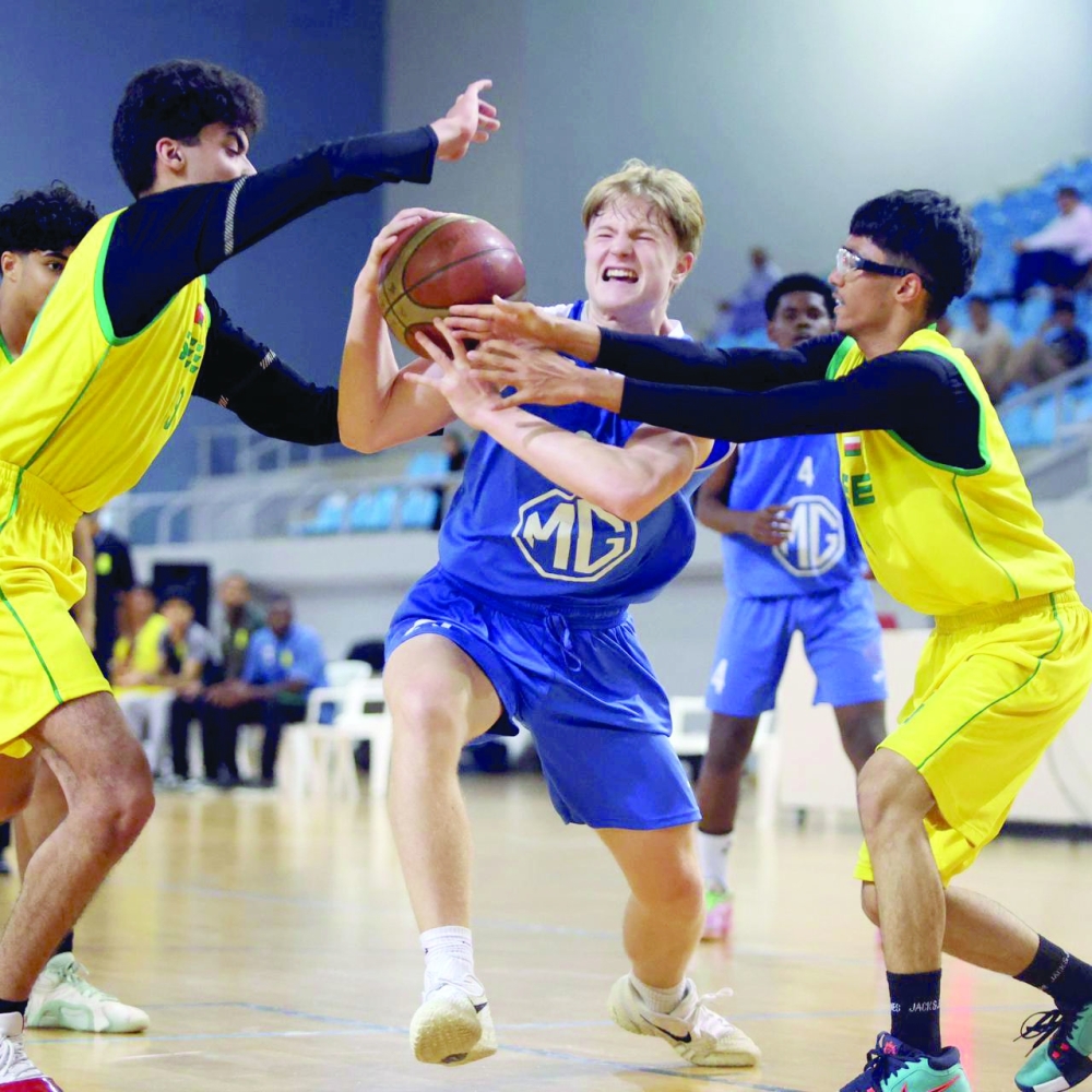 Al Seeb and Al Amerat players fight for the ball. — Moosa al Balushi


