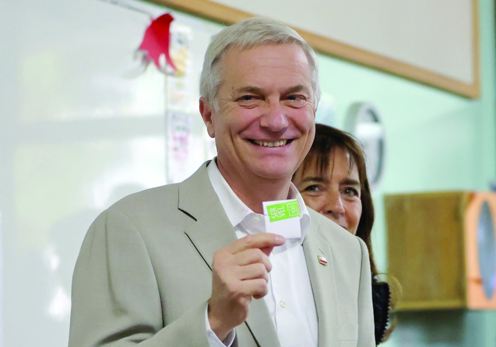 Chile's presidential candidate Jose Antonio Kast poses during the presidential runoff election in Paine. — AFP
